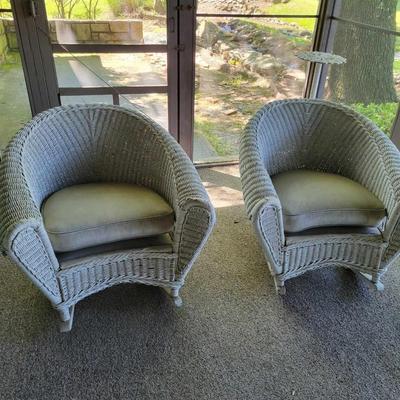 Pair of white wicker rocking outdoor chairs