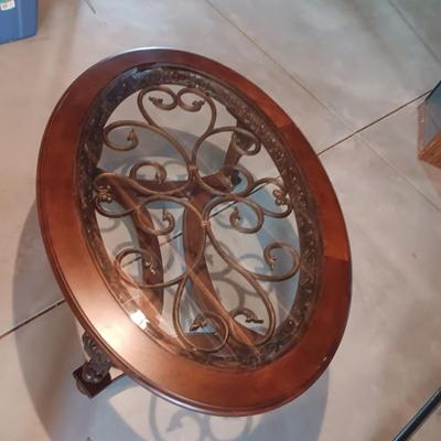 OVAL COFFEE TABLE WITH GLASS TOP AND METAL ACCENTS