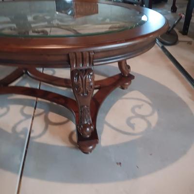 OVAL COFFEE TABLE WITH GLASS TOP AND METAL ACCENTS