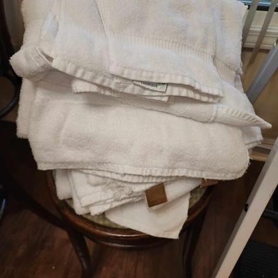 Lot of white bath towels