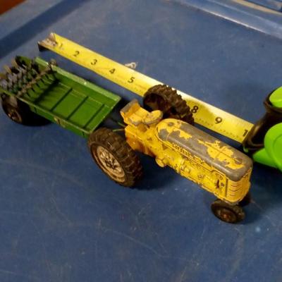 LOT 94 OLD METAL TOY TRACTOR AND MANURE SPREDER