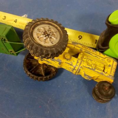 LOT 94 OLD METAL TOY TRACTOR AND MANURE SPREDER