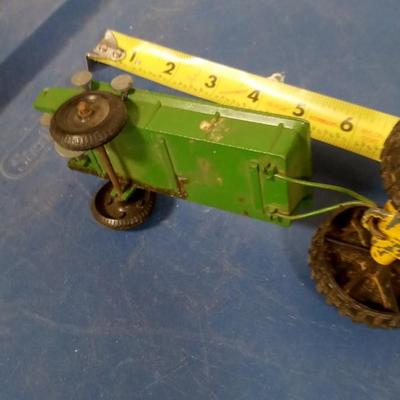 LOT 94 OLD METAL TOY TRACTOR AND MANURE SPREDER