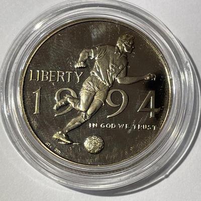 1994-P PROOF WORLD CUP SOCCER HALF DOLLAR IN A MINT HOLDER AS PICTURED.