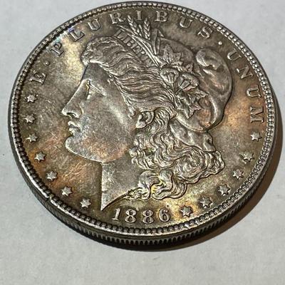 1886-P NICE ORIGINAL TONED UNCIRCULATED MORGAN SILVER DOLLAR AS PICTURED.