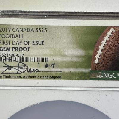 NGC CERTIFIED OVERSIZED HOLDER CANADA 2017 FIRST DAY ISSUE FOOTBALL $25 COIN HOLDER & CARD HAND SIGNED BY JOE THEISMANN.