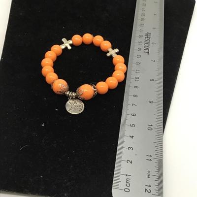 Be strong orange beaded bracelet