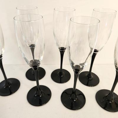 Lot #64 Lot of 7 Contemporary Black/Clear Wine Glasses - each 9