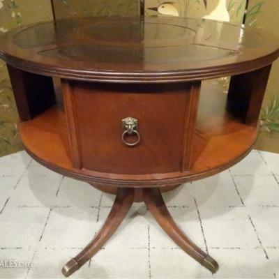 LOT 103: LEATHER TOP LIBRARY DRUM TABLE, PEDESTAL BASE, BRASS CAP FEET