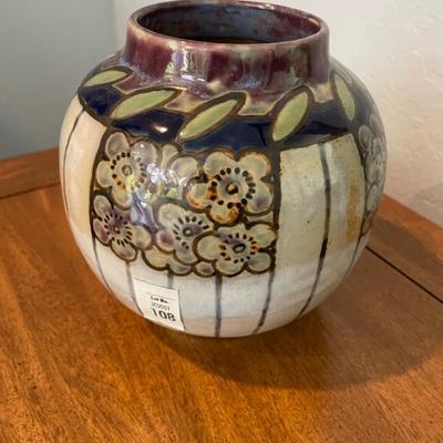 Pottery vase with floral motif.