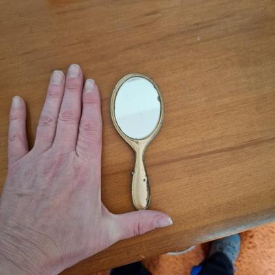 Small hand held mirror