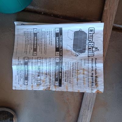 HIBACHI, CANS OF PROPANE, BEVERAGE COOLER AND AN AXE