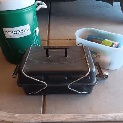 HIBACHI, CANS OF PROPANE, BEVERAGE COOLER AND AN AXE