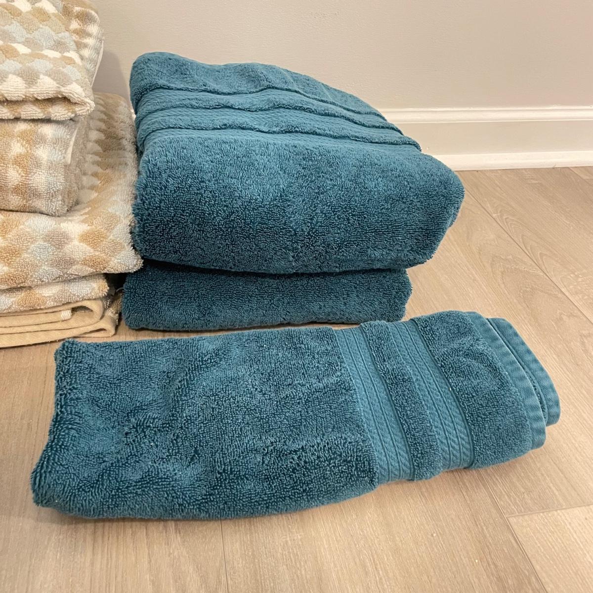 Four Sets of Bath Towels Rugs LR SS EstateSales