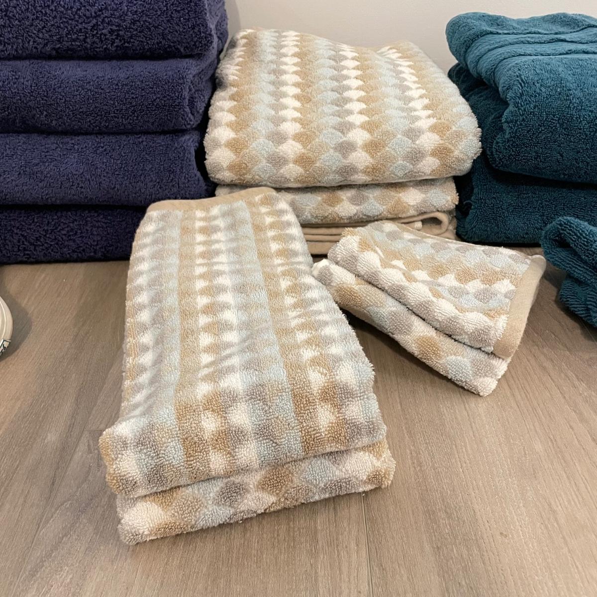 Four Sets of Bath Towels Rugs LR SS EstateSales