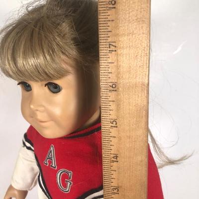 LOT 59G: American Girl Doll w/ Cheerleader Outfit, Purple Outfit w/ Denim Vest, Molly's Christmas Dress & More