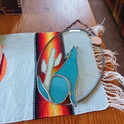 STAINED GLASS COYOTE, METAL CANDLE HOLDERS AND A WOVEN TABLE RUNNER