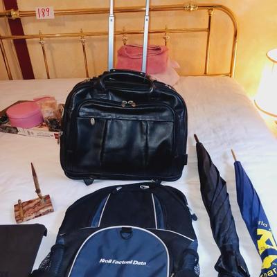 BRIEFCASE ON WHEELS W/HANDLE, 2 UMBRELLAS, BACKPACK AND MORE