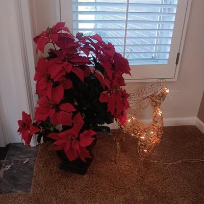 LARGE FAUX POINSETTIA IN A CERAMIC POT AND A LIGHTED METAL REINDEER