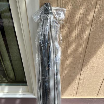 2 PATIO UMBRELLAS AND 4 MULTI-COLORED CUSHIONS