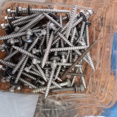 8 plastic containers with hardware - Screws - nails - and more