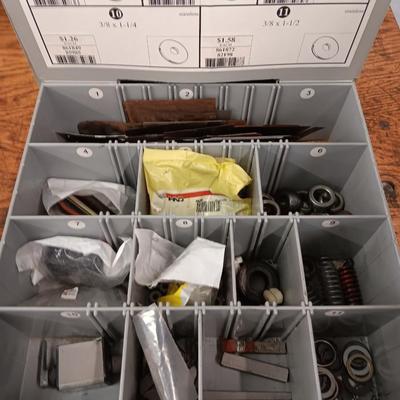 Drawered storage box with as assortment of brake parts small washers nuts - bolts - and hay baler bolts