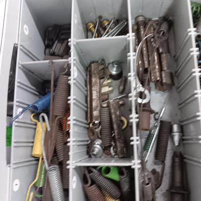 Drawered storage box with as assortment of brake parts small washers nuts - bolts - and hay baler bolts