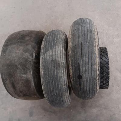 Assortment of 4 small different sized tires with rims