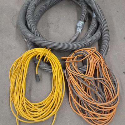 Two long outdoor extension cords and tubing extension for a shop vacuum