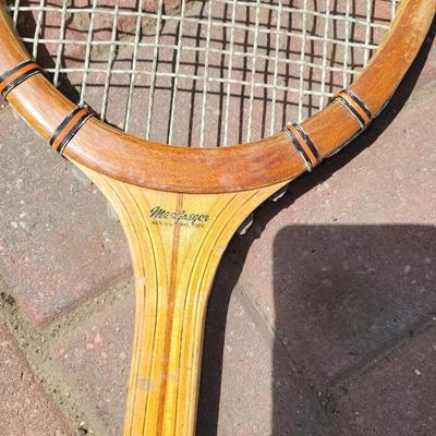 Vintage and antique tennis rackets, six baseballs and a boomerang