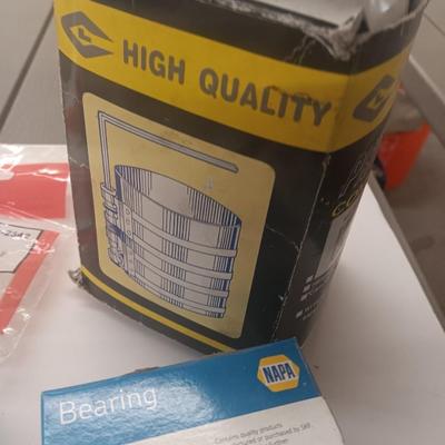 Small engine repair book with brand new car parts - U joints - Piston Ring Compressor - Trim panel retainers and more