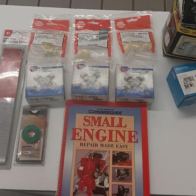 Small engine repair book with brand new car parts - U joints - Piston Ring Compressor - Trim panel retainers and more