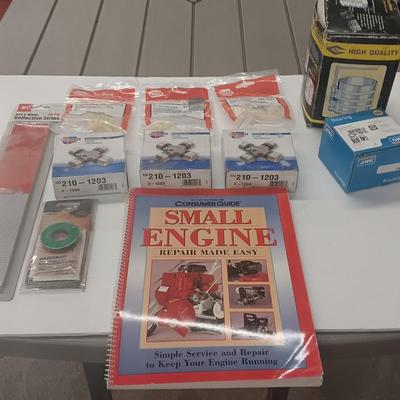 Small engine repair book with brand new car parts - U joints - Piston Ring Compressor - Trim panel retainers and more