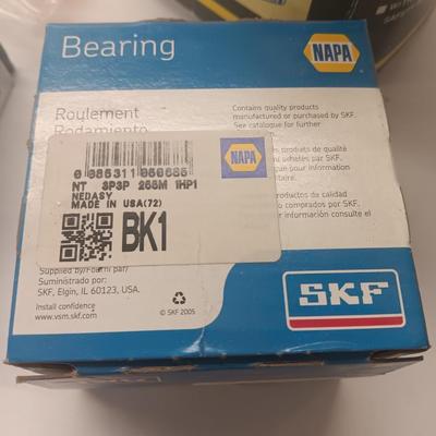 Small engine repair book with brand new car parts - U joints - Piston Ring Compressor - Trim panel retainers and more
