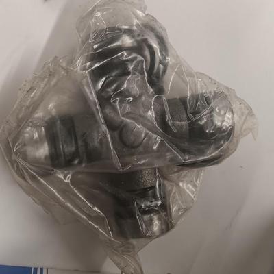 Small engine repair book with brand new car parts - U joints - Piston Ring Compressor - Trim panel retainers and more