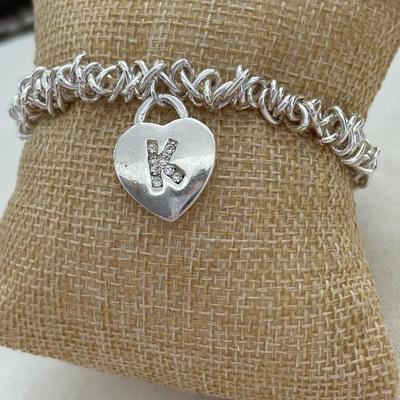 Silver tone stretchy bracelet with heart charm
