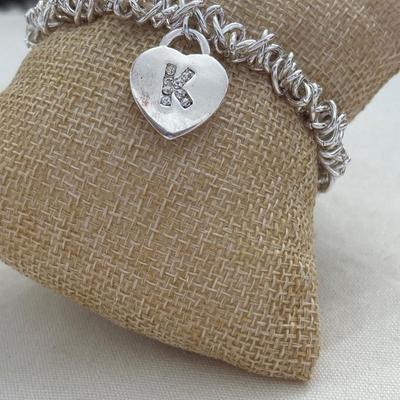 Silver tone stretchy bracelet with heart charm