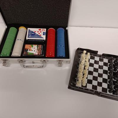 Poker chips in a metal case and a chess set