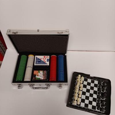Poker chips in a metal case and a chess set