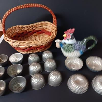 Antique aluminum Jello molds - ceramic rooster tea pot - and a decorative basket