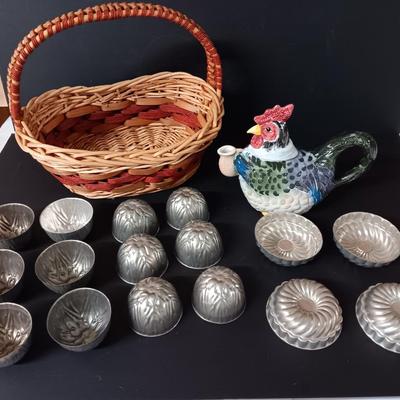 Antique aluminum Jello molds - ceramic rooster tea pot - and a decorative basket