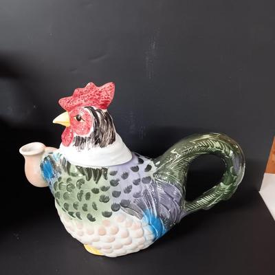 Antique aluminum Jello molds - ceramic rooster tea pot - and a decorative basket