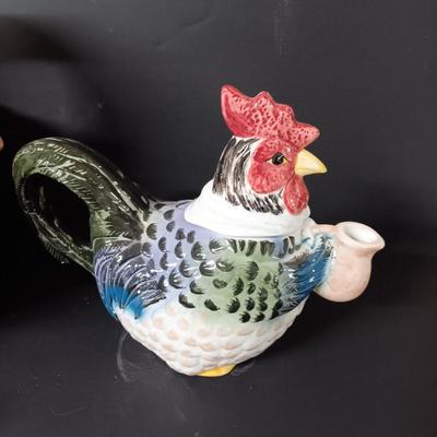 Antique aluminum Jello molds - ceramic rooster tea pot - and a decorative basket