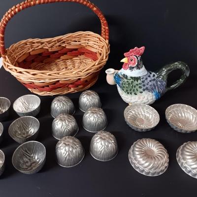 Antique aluminum Jello molds - ceramic rooster tea pot - and a decorative basket