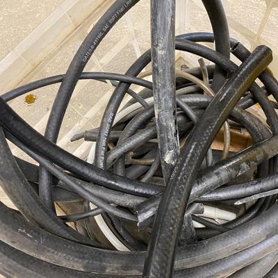 5 Gallon Yellow Fuel Can, Several Hose Remnants, drain pan and large warn Tarp