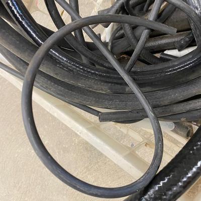 5 Gallon Yellow Fuel Can, Several Hose Remnants, drain pan and large warn Tarp