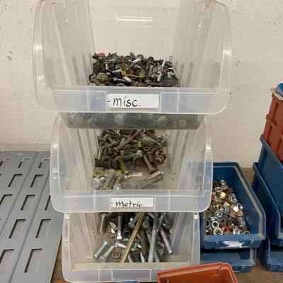 Organizing bins with a large variety of fasteners and other miscellaneous items