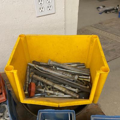 Organizing bins with a large variety of fasteners and other miscellaneous items