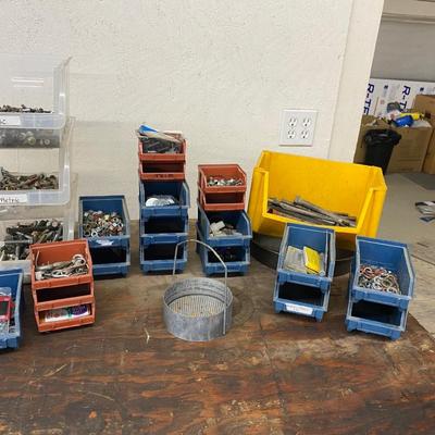 Organizing bins with a large variety of fasteners and other miscellaneous items