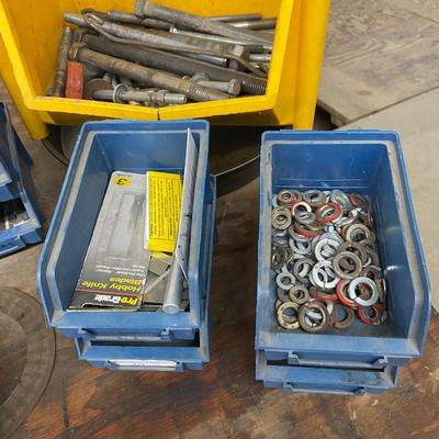 Organizing bins with a large variety of fasteners and other miscellaneous items